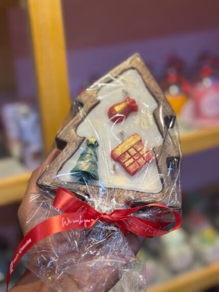 Christmas tree candle with wooden base