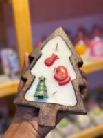 Wooden base candle in Christmas tree shape